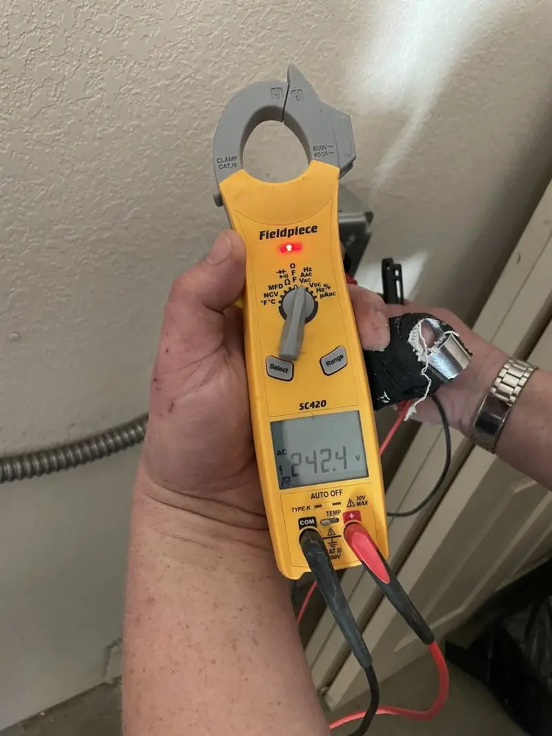 Voltage testing with clamp meter during Ceiling Fan Installation in Oxford